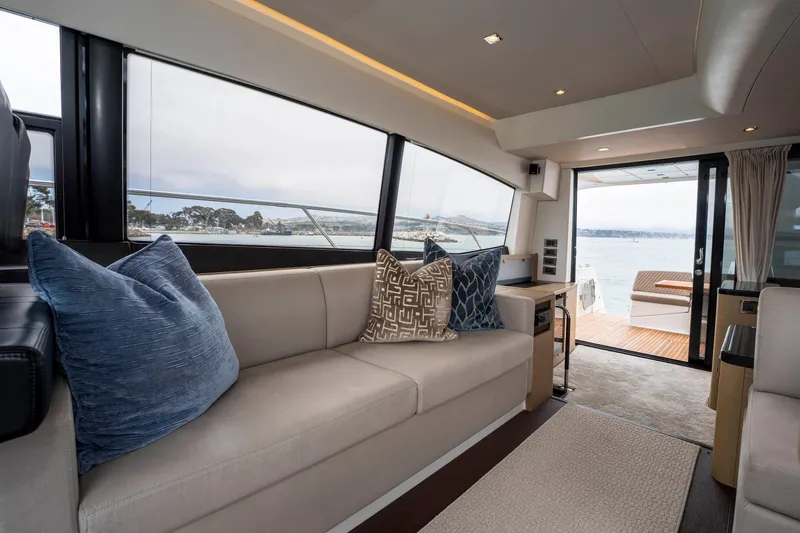 Seeworthy Yacht Photos Pics Luxurious interior of 2018 Prestige 560 yacht with elegant seating and ocean view.