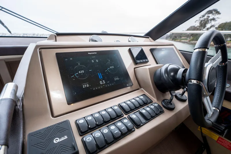 Seeworthy Yacht Photos Pics Cockpit of 2018 Prestige 560 yacht with advanced navigation controls and steering wheel.