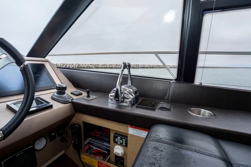 Seeworthy Yacht Photos Pics Interior helm of 2018 Prestige 560 yacht with modern controls and sea view.