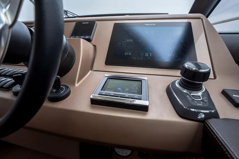 Seeworthy Yacht Photos Pics Control panel of a 2018 Prestige 560 yacht with navigation display and joystick.