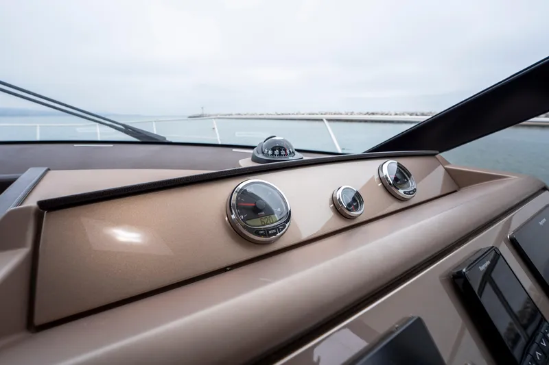 Seeworthy Yacht Photos Pics Control panel of a 2018 Prestige 560 yacht with gauges and compass.