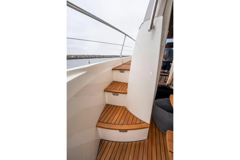 Seeworthy Yacht Photos Pics Staircase on 2018 Prestige 560 yacht with teak wood finish.