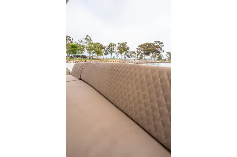 Seeworthy Yacht Photos Pics Luxurious seating on 2018 Prestige 560 yacht with quilted upholstery and scenic background.