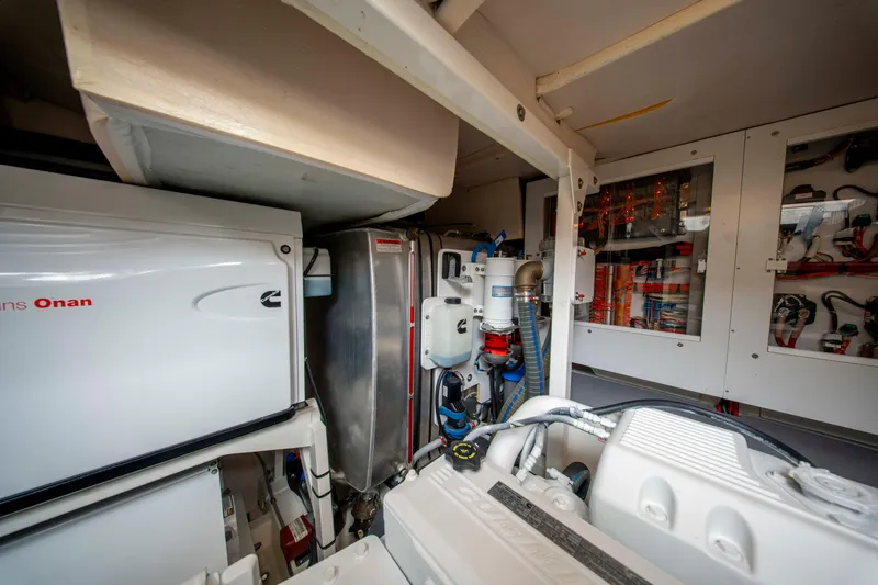 Seeworthy Yacht Photos Pics Engine room of a 2018 Prestige 560 yacht, featuring Cummins Onan generator and electrical systems.