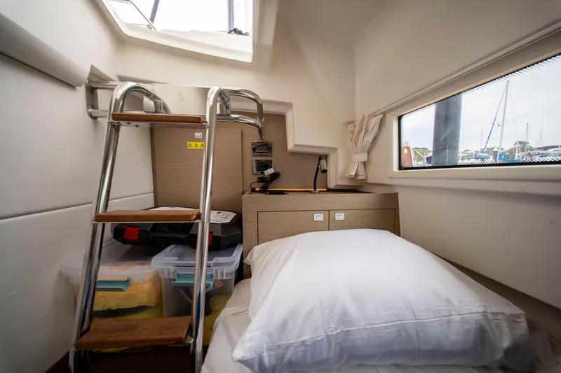 Seeworthy Yacht Photos Pics Cozy cabin interior of 2018 Prestige 560 yacht with ladder and storage.