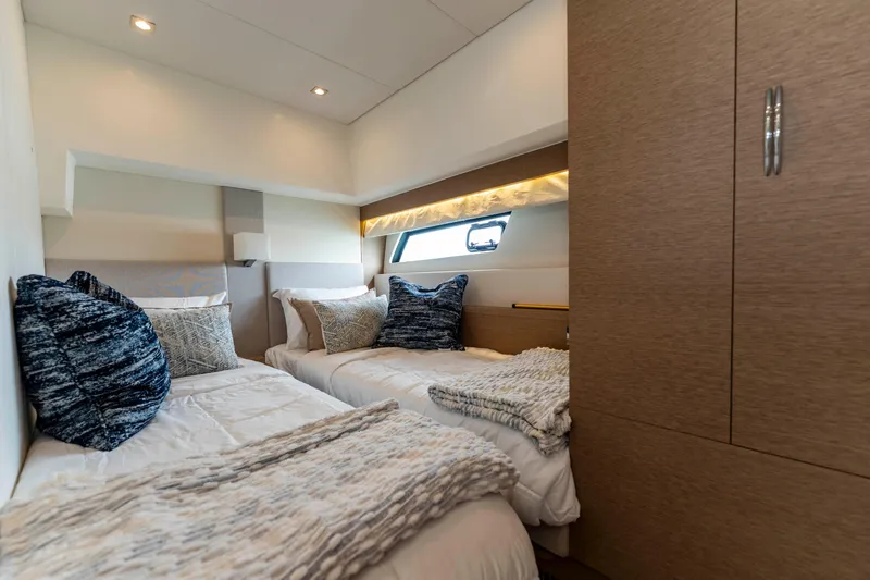 Seeworthy Yacht Photos Pics Luxurious twin bedroom in 2018 Prestige 560 yacht with modern decor and cozy bedding.