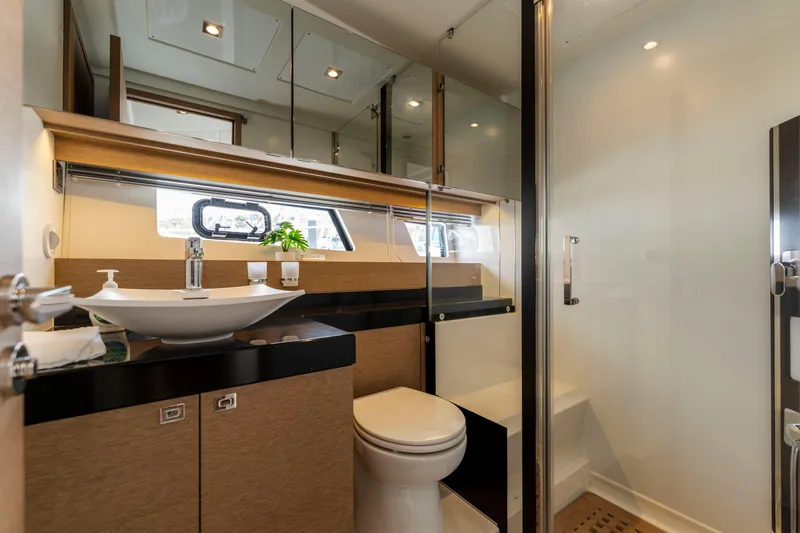 Seeworthy Yacht Photos Pics Luxurious bathroom in 2018 Prestige 560 yacht with modern fixtures and elegant design.