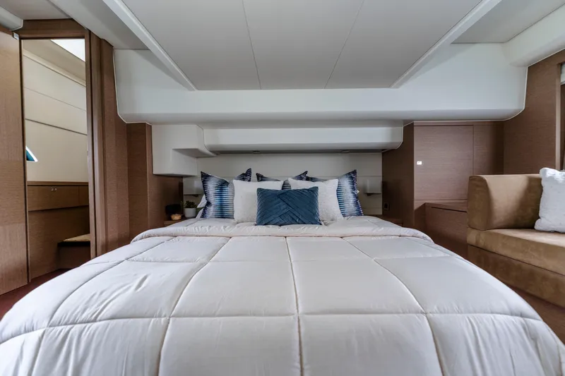 Seeworthy Yacht Photos Pics Luxurious bedroom interior of 2018 Prestige 560 yacht with plush bedding and modern design.