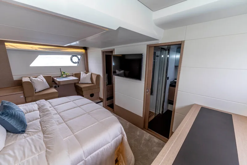 Seeworthy Yacht Photos Pics Luxurious interior of 2018 Prestige 560 yacht with elegant bedroom and seating area.