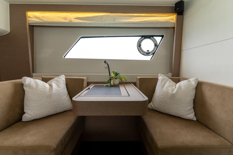 Seeworthy Yacht Photos Pics Luxurious interior of 2018 Prestige 560 yacht with elegant seating and window view.