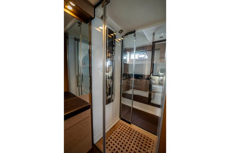 Seeworthy Yacht Photos Pics Luxurious bathroom interior on a 2018 Prestige 560 yacht with glass shower doors.