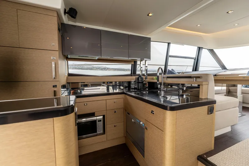 Seeworthy Yacht Photos Pics Luxurious kitchen interior of 2018 Prestige 560 yacht with modern appliances and sleek design.