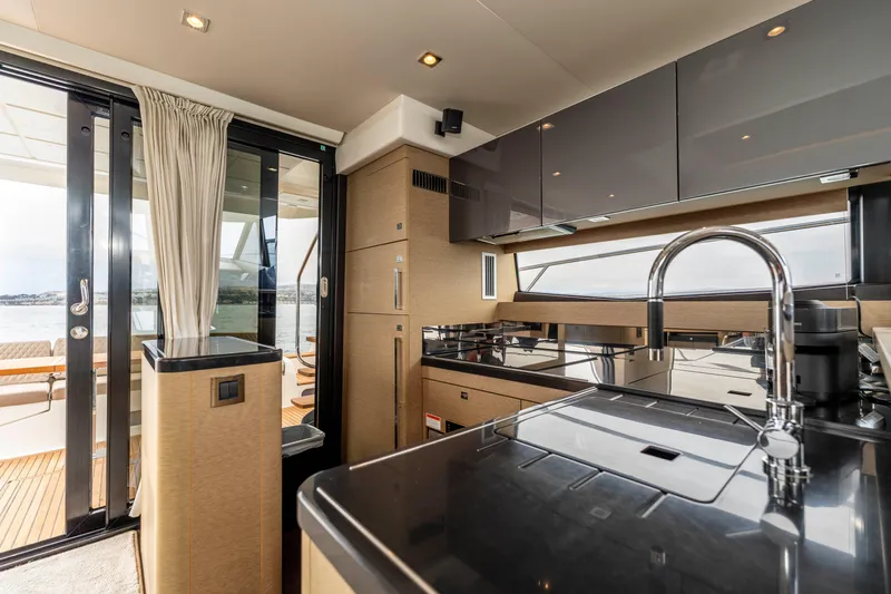 Seeworthy Yacht Photos Pics Luxurious kitchen interior of 2018 Prestige 560 yacht with modern amenities and sleek design.