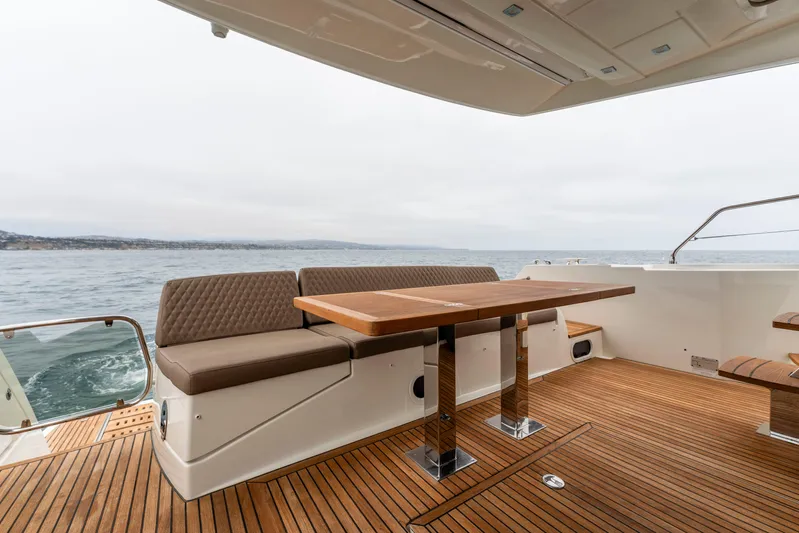 Seeworthy Yacht Photos Pics Luxurious 2018 Prestige 560 yacht deck with elegant seating and ocean view.