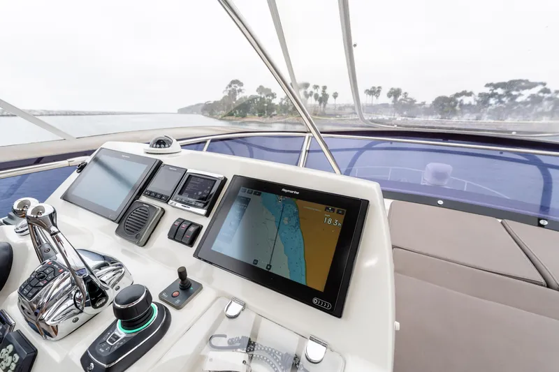 Seeworthy Yacht Photos Pics Cockpit of 2018 Prestige 560 yacht with navigation screens and controls.