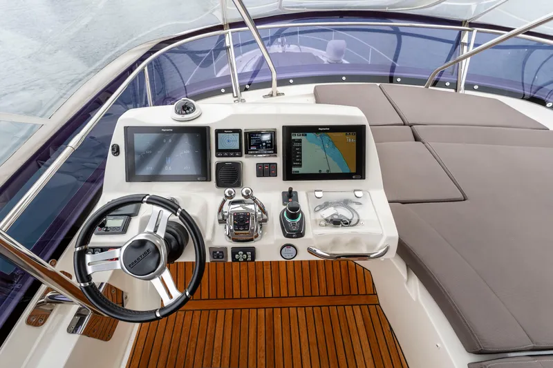 Seeworthy Yacht Photos Pics Cockpit of 2018 Prestige 560 yacht with advanced navigation controls and luxurious seating.
