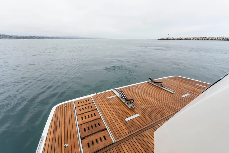 Seeworthy Yacht Photos Pics Luxury yacht deck of 2018 Prestige 560 overlooking calm ocean waters.