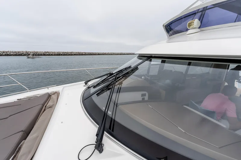 Seeworthy Yacht Photos Pics 2018 Prestige 560 yacht on calm waters, showcasing sleek design and spacious deck.