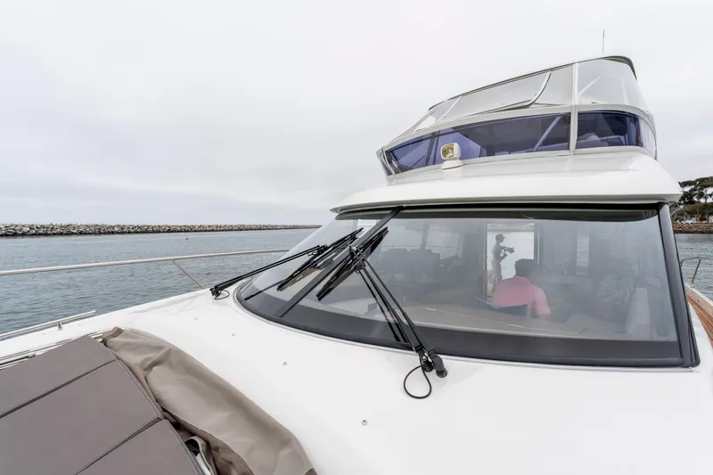 Seeworthy Yacht Photos Pics 2018 Prestige 560 yacht on calm waters, featuring sleek design and spacious deck.