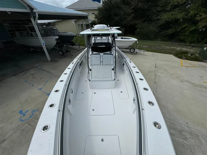  Yacht Photos Pics 2022 Nor-Tech 392 Super Fish boat, sleek design, spacious deck, parked outdoors.