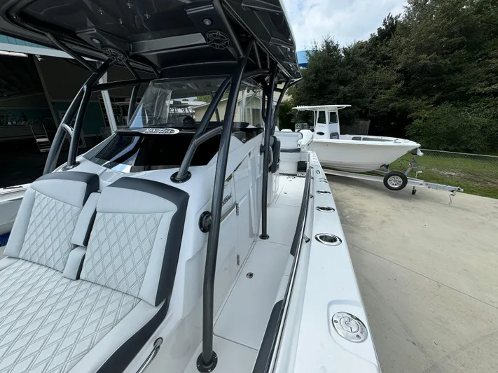  Yacht Photos Pics 2022 Nor-Tech 392 Super Fish boat with sleek design and spacious seating.