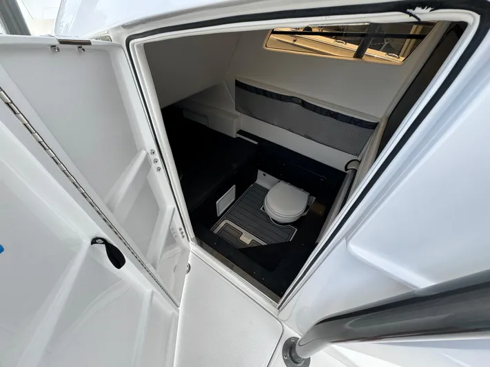  Yacht Photos Pics 2022 Nor-Tech 392 Super Fish boat cabin interior with toilet.