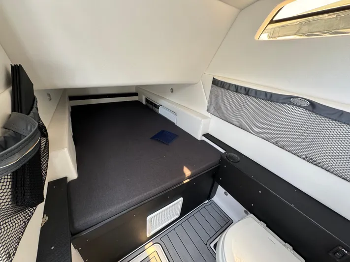  Yacht Photos Pics 2022 Nor-Tech 392 Super Fish cabin interior with bed and storage compartments.