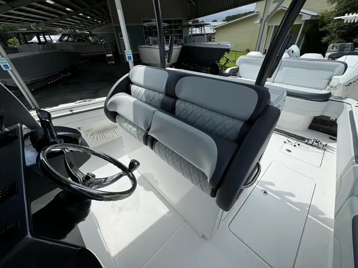  Yacht Photos Pics 2022 Nor-Tech 392 Super Fish boat interior with dual seating and steering wheel.