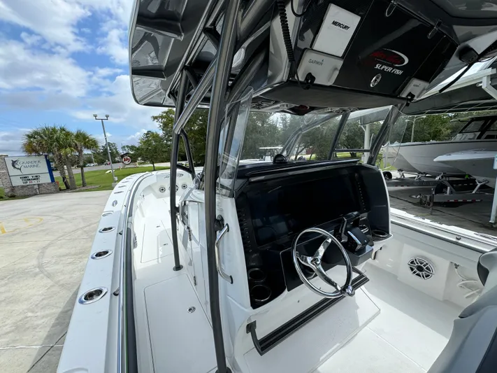  Yacht Photos Pics 2022 Nor-Tech 392 Super Fish boat interior with steering wheel and control panel.