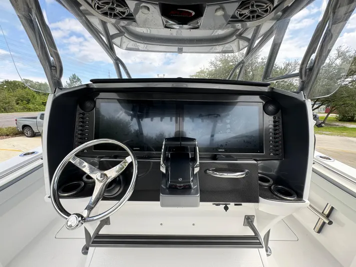 Yacht Photos Pics 2022 Nor-Tech 392 Super Fish boat dashboard with steering wheel and controls.