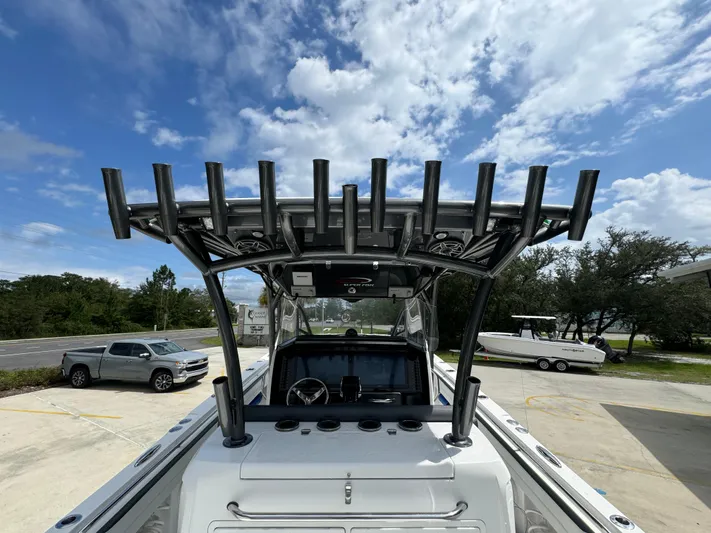  Yacht Photos Pics 2022 Nor-Tech 392 Super Fish boat with rod holders, parked outdoors under a cloudy sky.