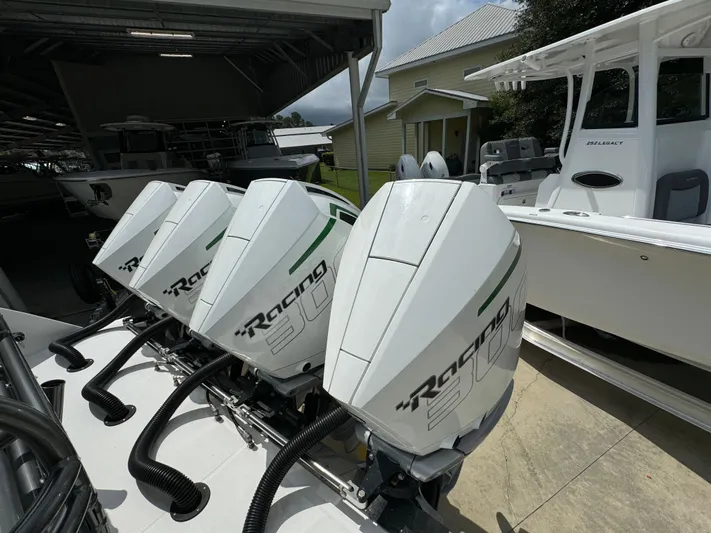  Yacht Photos Pics 2022 Nor-Tech 392 Super Fish with powerful outboard engines in a marina setting.