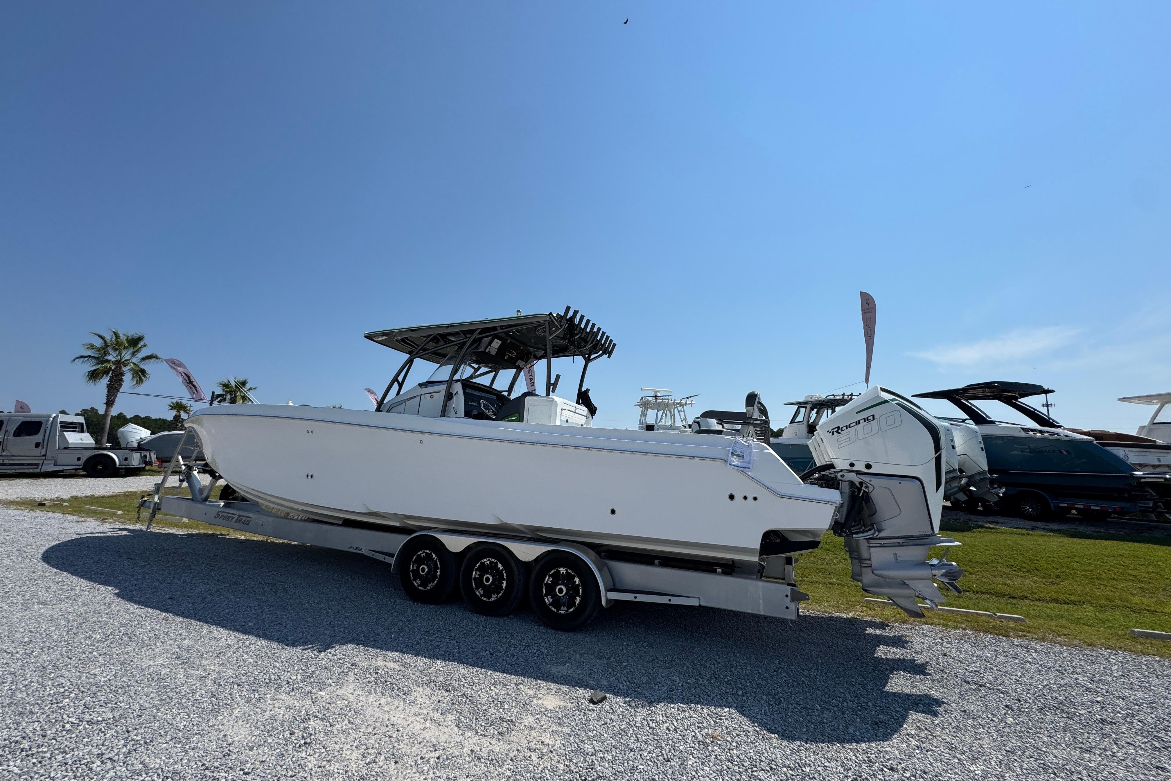 2022 Nor-Tech 392 Super Fish boat on trailer, parked outdoors under clear blue sky.