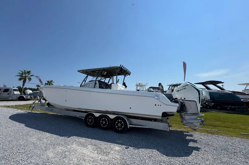  Yacht Photos Pics 2022 Nor-Tech 392 Super Fish boat on trailer, parked outdoors under clear blue sky.