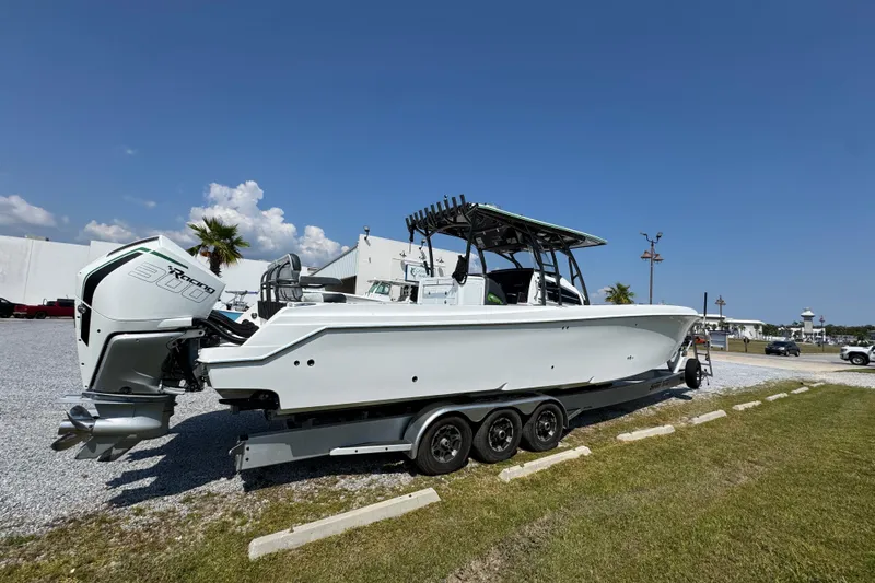  Yacht Photos Pics 2022 Nor-Tech 392 Super Fish boat on trailer, parked outdoors under clear blue sky.