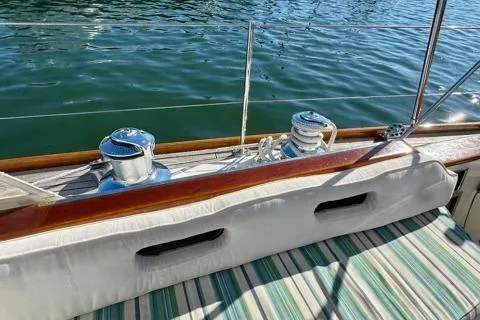 Symphony V Yacht Photos Pics Hinckley Sou'wester 52 (1999) deck view with winches and striped seating.