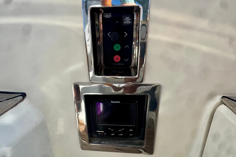 Symphony V Yacht Photos Pics Control panel on a 1999 Hinckley Sou'wester 52 yacht, featuring navigation and power controls.