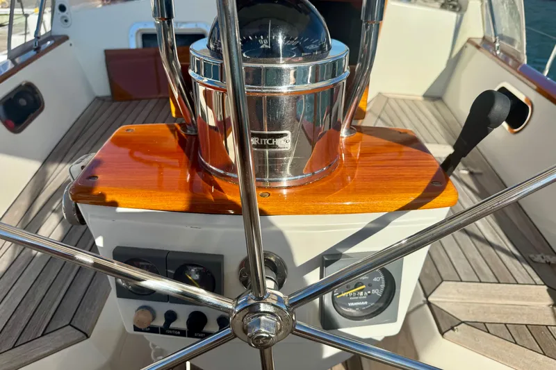 Symphony V Yacht Photos Pics Hinckley Sou'wester 52 yacht helm with compass and controls, 1999 model.