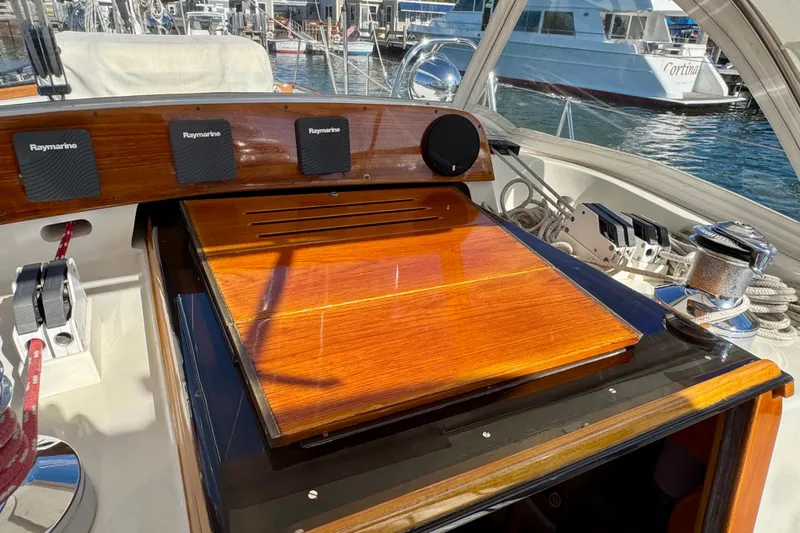 Symphony V Yacht Photos Pics Cockpit of 1999 Hinckley Sou'wester 52 sailboat with Raymarine instruments and wooden hatch.