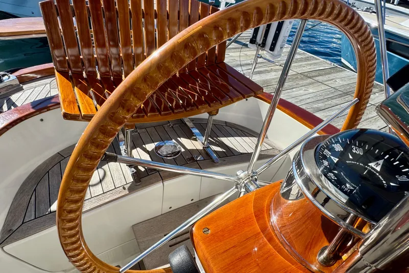 Symphony V Yacht Photos Pics Hinckley Sou'wester 52 yacht helm with wooden wheel and compass, 1999 model.