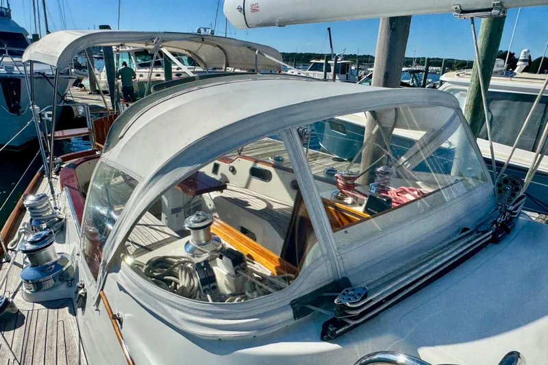 Symphony V Yacht Photos Pics Hinckley Sou'wester 52 sailboat, 1999 model, docked with visible winches and canopy.