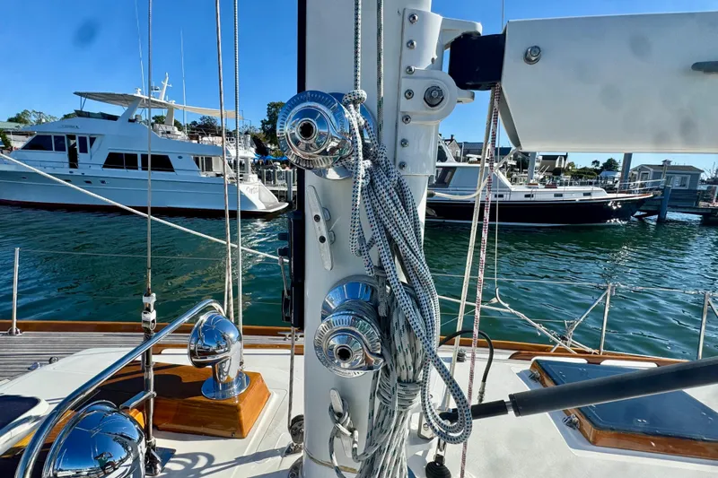 Symphony V Yacht Photos Pics Hinckley Sou'wester 52 sailboat deck with rigging, docked in a marina, 1999 model.