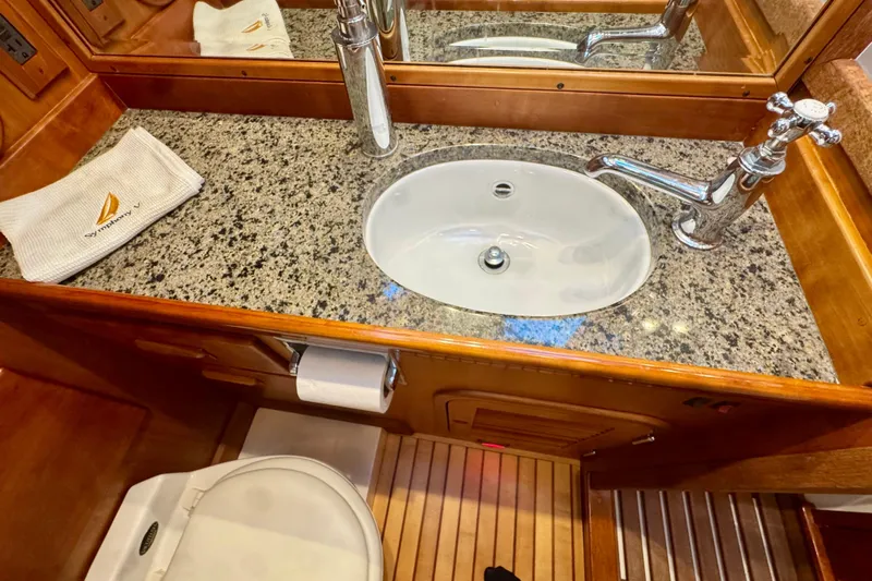 Symphony V Yacht Photos Pics Hinckley Sou'wester 52 yacht bathroom with granite countertop and elegant fixtures, 1999 model.