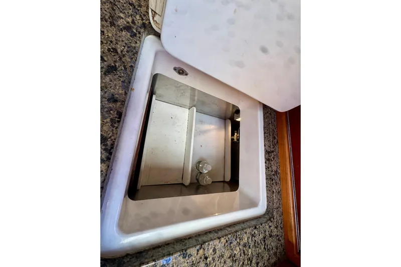 Symphony V Yacht Photos Pics Hinckley Sou'wester 52 (1999) yacht interior sink with granite countertop.