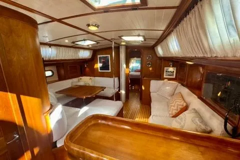 Symphony V Yacht Photos Pics Luxurious interior of a 1999 Hinckley Sou'wester 52 yacht with elegant wood finishes.