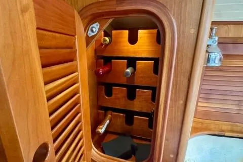 Symphony V Yacht Photos Pics Wooden wine rack inside 1999 Hinckley Sou'wester 52 yacht cabin.