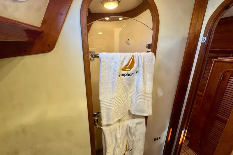 Symphony V Yacht Photos Pics Luxury bathroom interior of 1999 Hinckley Sou'wester 52 yacht with embroidered towels.
