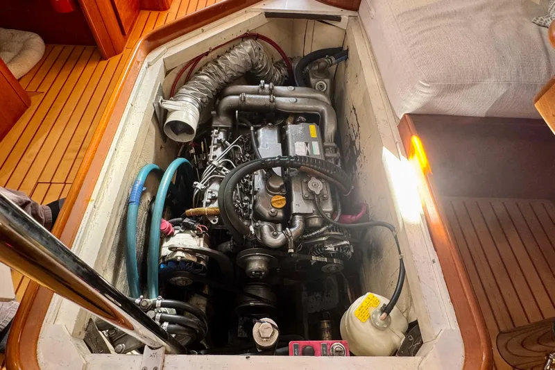Symphony V Yacht Photos Pics Engine compartment of a 1999 Hinckley Sou'wester 52 sailboat, showcasing detailed mechanical components.