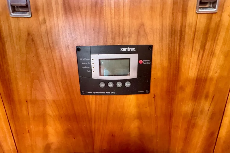 Symphony V Yacht Photos Pics Xantrex control panel on 1999 Hinckley Sou'wester 52 yacht's wooden interior.
