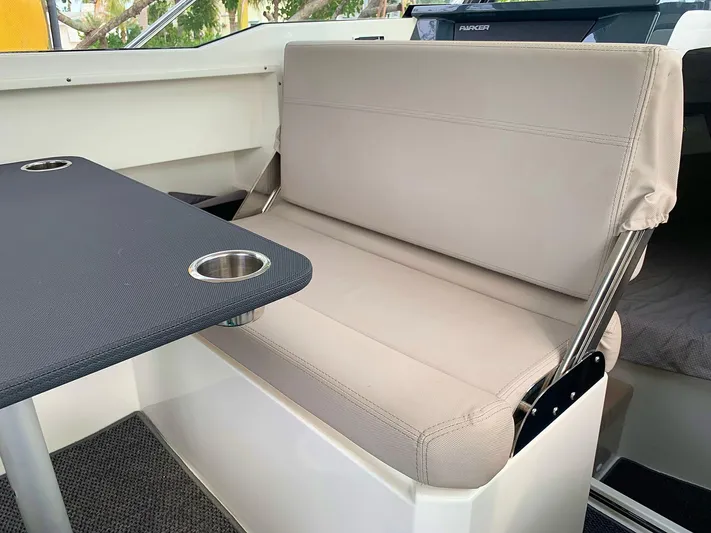  Yacht Photos Pics Interior seating of 2022 Hussar Skamander 920 Explorer MAX with table and cup holders.